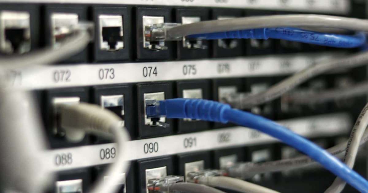 Network cables and switch—representing API connectivity, inventory, and mapping what is actually routed