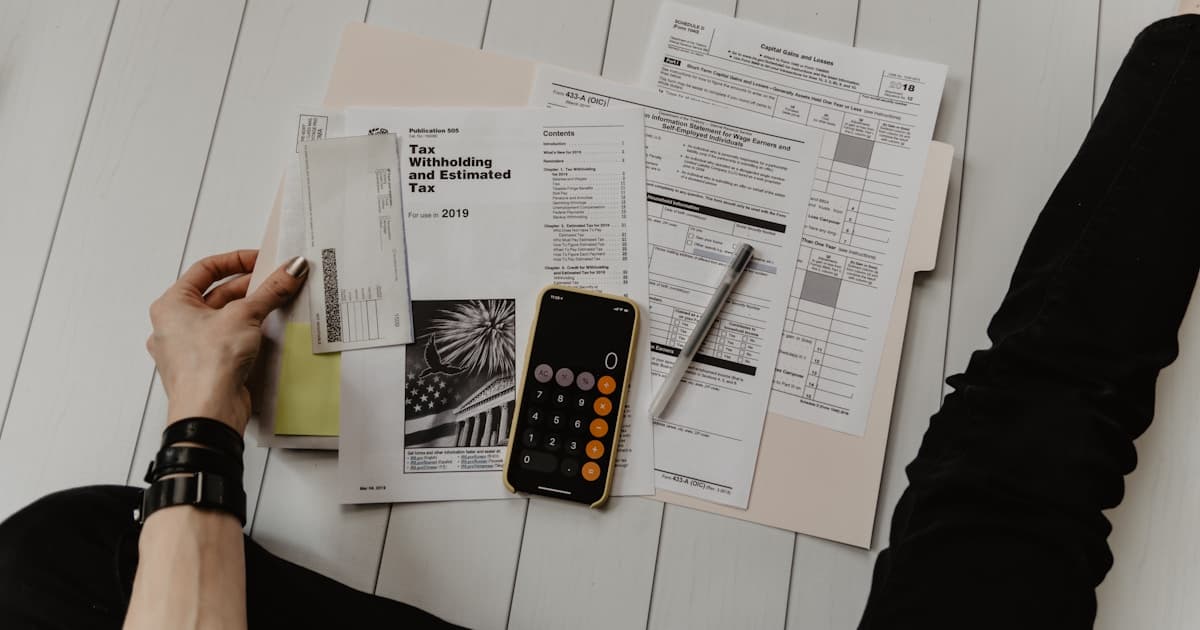 Financial documents and calculator—representing total cost of ownership and lock-in economics